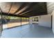 Spacious covered patio with concrete flooring and rod iron railing at 6324 Eugene Ave, Las Vegas, NV 89108