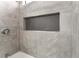 Close-up of shower with gray tiling and storage niche at 6324 Eugene Ave, Las Vegas, NV 89108