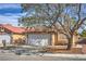 Well-maintained single-Gathering home with xeriscape landscaping, a driveway, and charming curb appeal at 6408 Deadwood Rd, Las Vegas, NV 89108