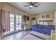 Relaxing main bedroom with access to backyard pool through French doors at 6408 Deadwood Rd, Las Vegas, NV 89108