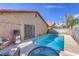 Secluded backyard featuring a pool, spa, and outdoor seating area perfect for entertaining or relaxing at 6408 Deadwood Rd, Las Vegas, NV 89108