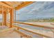 Balcony framing offering views of the serene water and picturesque landscaping at 65 Bellissima Lago Ct, Henderson, NV 89011