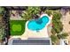 Aerial shot of a private backyard oasis featuring a custom pool, putting green, and mature landscaping at 6773 Obannon Dr, Las Vegas, NV 89146