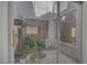This bright and airy atrium provides a relaxing indoor garden space and natural light at 6773 Obannon Dr, Las Vegas, NV 89146