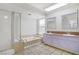 Bathroom with a soaking tub, walk in shower, and a double sink vanity at 6773 Obannon Dr, Las Vegas, NV 89146