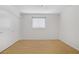 Bright bedroom featuring wood floors, a window with blinds, and a spacious closet at 6773 Obannon Dr, Las Vegas, NV 89146