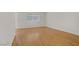Empty bedroom with hardwood floors and a window allowing natural light at 6773 Obannon Dr, Las Vegas, NV 89146