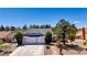 Charming home boasts mature landscaping, a well-maintained lawn, and a spacious two-car garage at 6773 Obannon Dr, Las Vegas, NV 89146