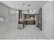 The updated kitchen offers black cabinets, stainless appliances, granite countertops and recessed lighting at 6773 Obannon Dr, Las Vegas, NV 89146