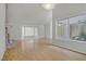 Bright living room features hardwood floors and many windows at 6773 Obannon Dr, Las Vegas, NV 89146