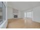 Bright living room features a fireplace and hardwood floors at 6773 Obannon Dr, Las Vegas, NV 89146