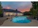 Inviting backyard featuring a sparkling blue swimming pool with a deck and a covered patio at 6773 Obannon Dr, Las Vegas, NV 89146