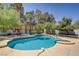 Inviting backyard pool and spa with lush landscaping providing a private oasis at 6773 Obannon Dr, Las Vegas, NV 89146