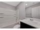 Clean bathroom featuring a tub-shower combo and a modern vanity at 7052 Blissful Peak St, North Las Vegas, NV 89084