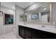 Modern bathroom featuring dual sinks, framed mirrors, and stylish fixtures at 7052 Blissful Peak St, North Las Vegas, NV 89084