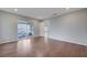 Large bedroom with a sliding glass door to backyard patio and wood flooring at 7052 Blissful Peak St, North Las Vegas, NV 89084