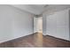 Empty bedroom with wood-look floors, closet, and neutral walls at 7052 Blissful Peak St, North Las Vegas, NV 89084