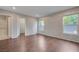 Spacious bedroom with wood floors, ensuite bathroom and a walk-in closet at 7052 Blissful Peak St, North Las Vegas, NV 89084