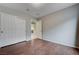 Bedroom features laminate floors, closet, and neutral walls at 7052 Blissful Peak St, North Las Vegas, NV 89084