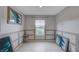 Stylish dining area with wainscoting and contemporary art at 7052 Blissful Peak St, North Las Vegas, NV 89084