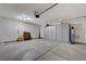 Clean, organized garage with built-in cabinets and shelving, perfect for storage and projects at 7052 Blissful Peak St, North Las Vegas, NV 89084