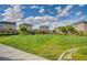 Well-maintained community green space featuring manicured landscaping, a bench, and single-Gathering homes at 7052 Blissful Peak St, North Las Vegas, NV 89084