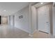 Long, bright hallway featuring white walls and light wood flooring at 7052 Blissful Peak St, North Las Vegas, NV 89084