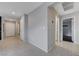 Neutral hallway featuring tile flooring and access to multiple rooms at 7052 Blissful Peak St, North Las Vegas, NV 89084