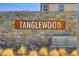 Tanglewood neighborhood stone signage with metal lettering and desert landscaping at 7052 Blissful Peak St, North Las Vegas, NV 89084