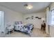 Well-lit bedroom with soft carpet, natural light, and stylish decor at 718 Nectarine Ct, Henderson, NV 89014