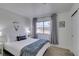 Calm bedroom with white walls, neutral accents, and a window overlooking the neighborhood at 718 Nectarine Ct, Henderson, NV 89014