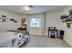 Bright bedroom with plush carpet, large window, and neutral walls at 718 Nectarine Ct, Henderson, NV 89014