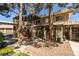 Charming two-story townhouse featuring well-maintained landscaping and a private balcony at 718 Nectarine Ct, Henderson, NV 89014