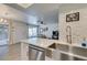Spacious kitchen with stainless steel appliances, island seating, and an open layout to the living area at 718 Nectarine Ct, Henderson, NV 89014