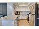 Modern kitchen featuring stainless steel appliances, white cabinets, and sleek countertops at 718 Nectarine Ct, Henderson, NV 89014