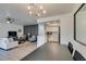 View of the living room and kitchen showcasing the open layout and bright ambiance at 718 Nectarine Ct, Henderson, NV 89014