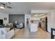 Open-concept living area flows into a modern kitchen with stainless steel appliances at 718 Nectarine Ct, Henderson, NV 89014