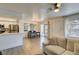 Combined living and kitchen area with stainless steel appliances and dining table at 718 Nectarine Ct, Henderson, NV 89014