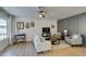 Comfortable living room with ample natural light, a ceiling fan, and modern decor at 718 Nectarine Ct, Henderson, NV 89014
