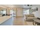 Open living space features lots of natural light, ceiling fan, and access to the patio at 718 Nectarine Ct, Henderson, NV 89014