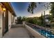 Balcony view overlooking the sparkling pool and the perfectly manicured backyard at 7501 Midnight Rambler St, Las Vegas, NV 89149