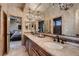 Elegant bathroom with double sinks, custom cabinetry, and luxurious finishes at 7501 Midnight Rambler St, Las Vegas, NV 89149