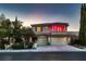 Charming two-story home with a three-car garage, lush landscaping, and inviting curb appeal at 7501 Midnight Rambler St, Las Vegas, NV 89149