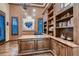 Well-appointed home office with custom built-ins, wood floors, and ample natural light for productivity at 7501 Midnight Rambler St, Las Vegas, NV 89149