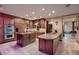 Gourmet kitchen with custom cabinetry, stainless steel appliances, and dual islands for ample workspace at 7501 Midnight Rambler St, Las Vegas, NV 89149