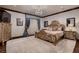 Ornate main bedroom featuring a luxurious bed, chandelier, and elegant furnishings at 7501 Midnight Rambler St, Las Vegas, NV 89149