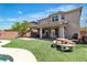 Beautiful backyard featuring an extended covered patio, outdoor gym and synthetic grass at 7545 Fontera Ct, Las Vegas, NV 89139
