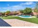 Stunning backyard with pool, spa, lush artificial turf and playhouse at 7545 Fontera Ct, Las Vegas, NV 89139