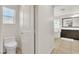 Stylish bathroom features tile floors, dark wood vanity, and large framed mirror at 7545 Fontera Ct, Las Vegas, NV 89139