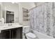 Bright bathroom with vanity, combination tub and shower, and paris-themed curtain at 7545 Fontera Ct, Las Vegas, NV 89139